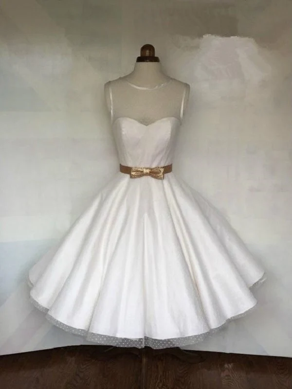 Robe de mariée longueur thé à pois style années 50 avec reliure en satin