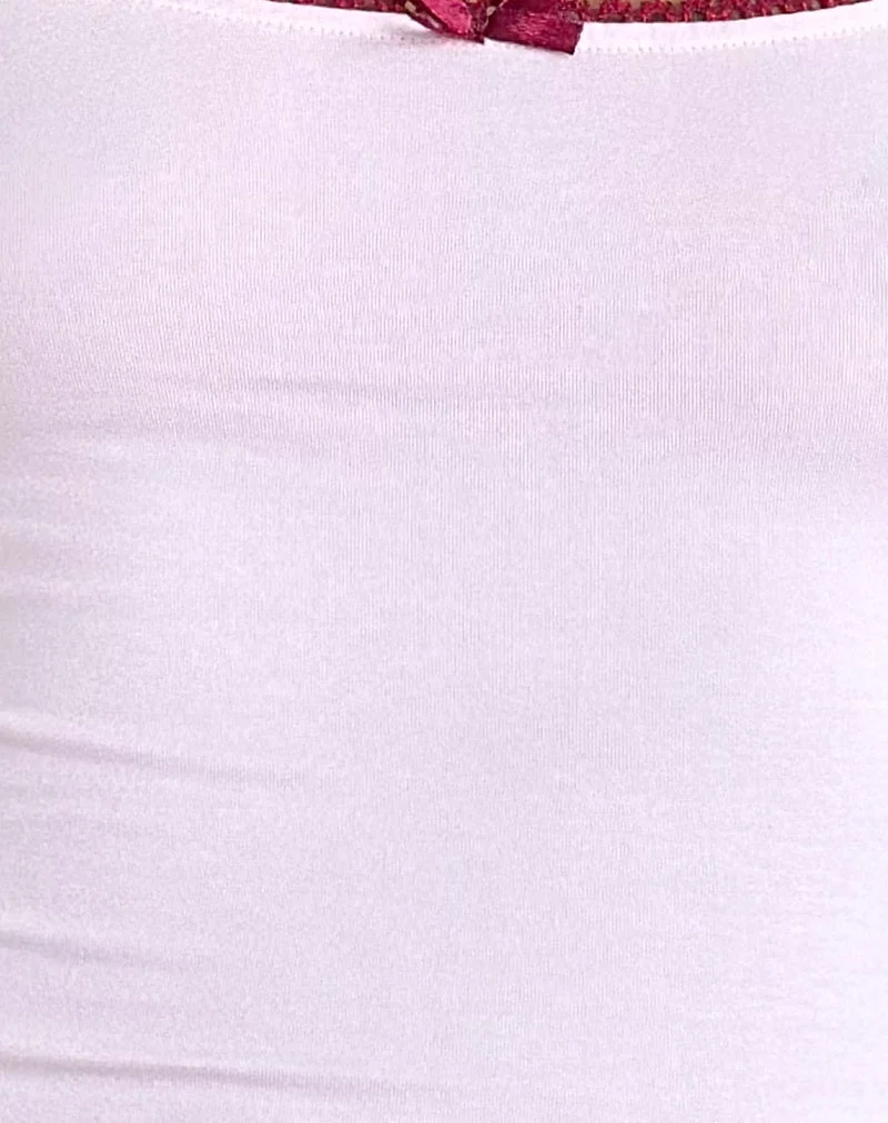 Top de gilet Suna en rose clair avec bordures en bourgogne