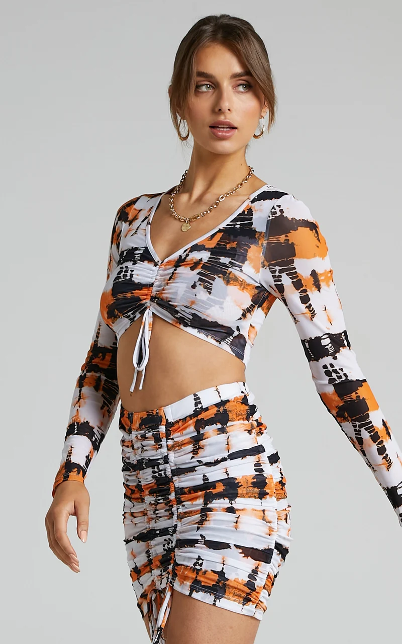 BY DYLN - Odette Mini Skirt in Orange Printed Mesh