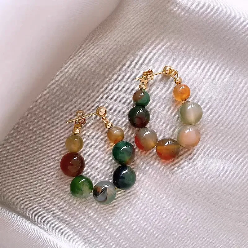 Boucles d'oreilles avec pierres vertes
