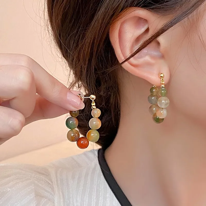 Boucles d'oreilles avec pierres vertes