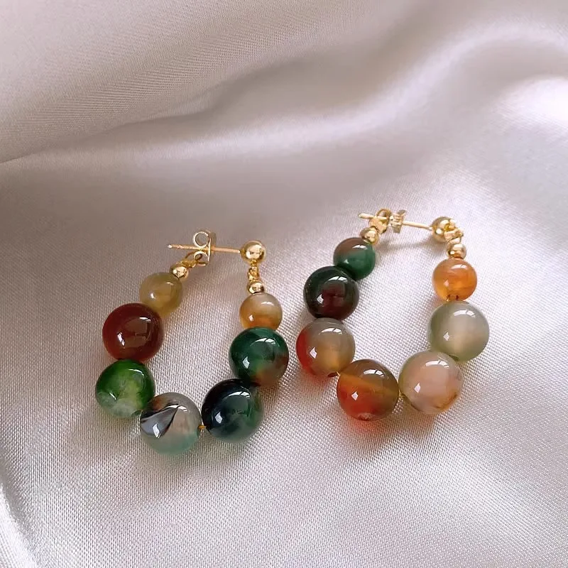 Boucles d'oreilles avec pierres vertes