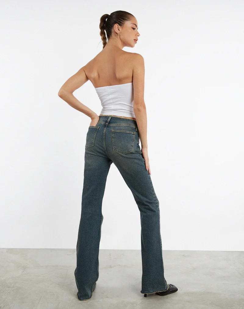 Jean à taille basse effiloché en brun et bleu acidulé