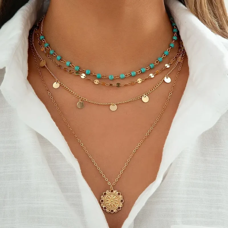 Collier 4 pièces or et pendentif feuille