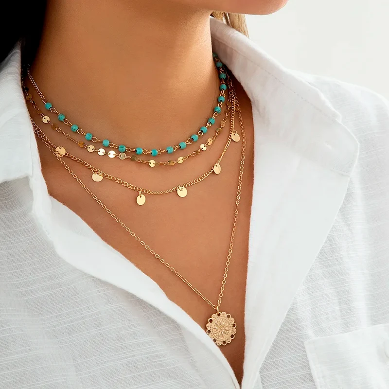 Collier 4 pièces or et pendentif feuille