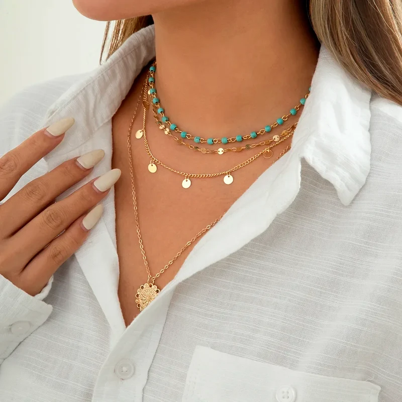 Collier 4 pièces or et pendentif feuille