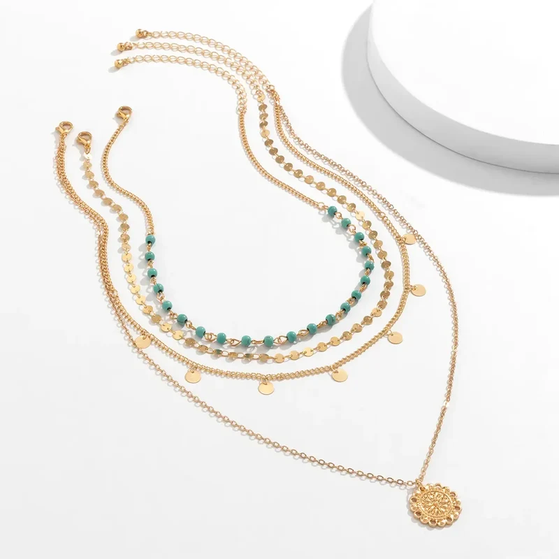 Collier 4 pièces or et pendentif feuille