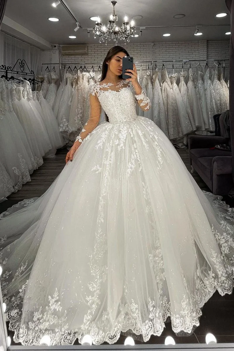 Robe de mariée en tulle transparent avec manches longues et appliques