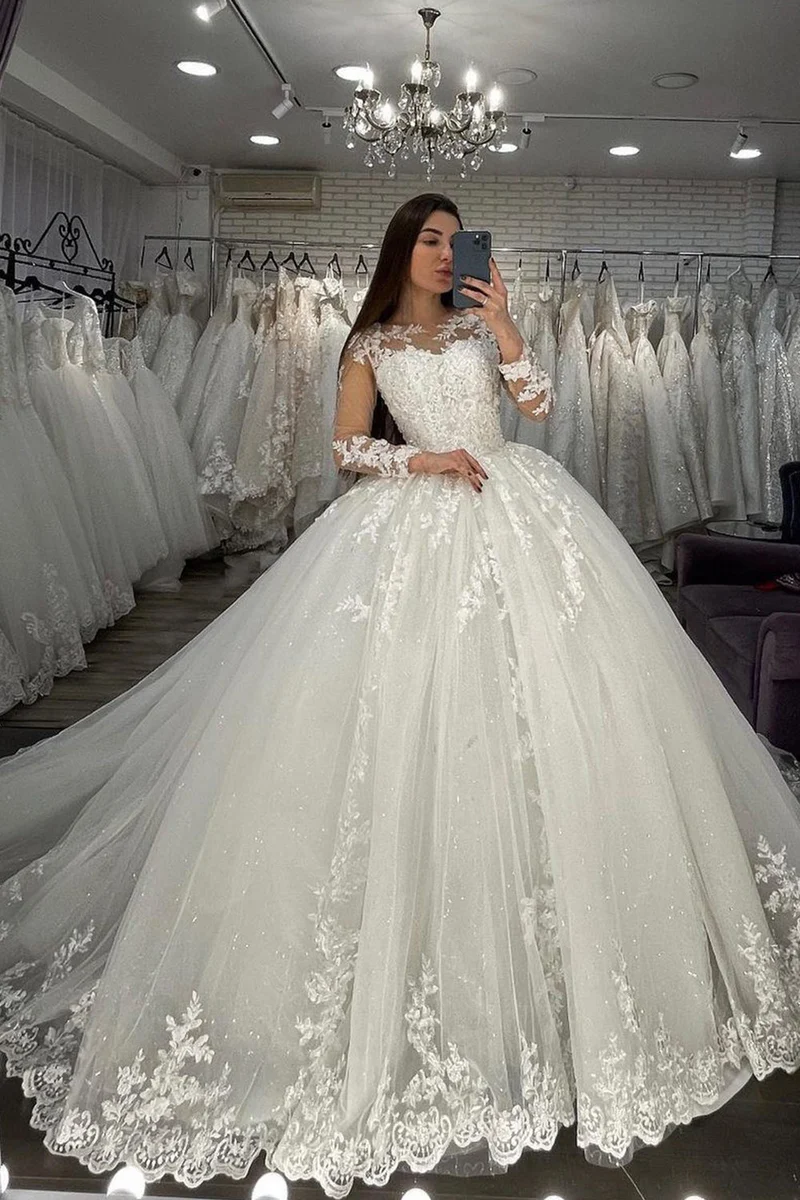 Robe de mariée en tulle transparent avec manches longues et appliques