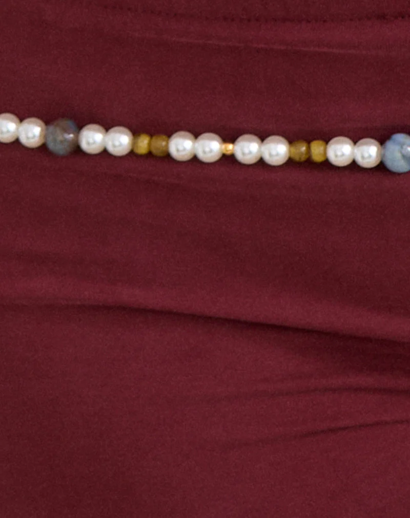 Short Nissa avec bordure en perles, en cupro bordeaux