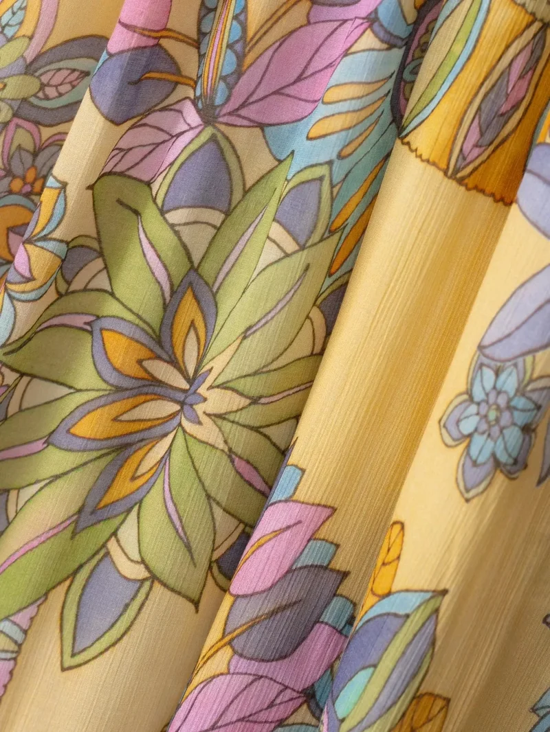 Robe d’été fluide à bretelles imprimé floral en mousseline