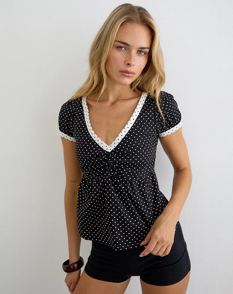 Haut Caixi en noir et blanc avec un motif de micro-pois