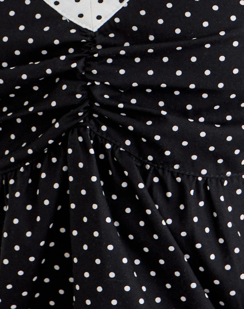 Haut Caixi en noir et blanc avec un motif de micro-pois