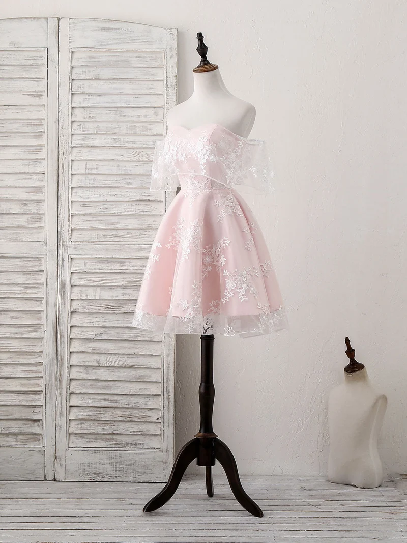 Robe de bal courte en tulle rose, élégante et décolletée en cœur, idéale pour les fêtes et les retrouvailles.