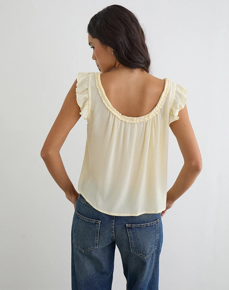 Haut Merisso à encolure rond et découpe en forme de trou de serrure, couleur jaune beurre froissé