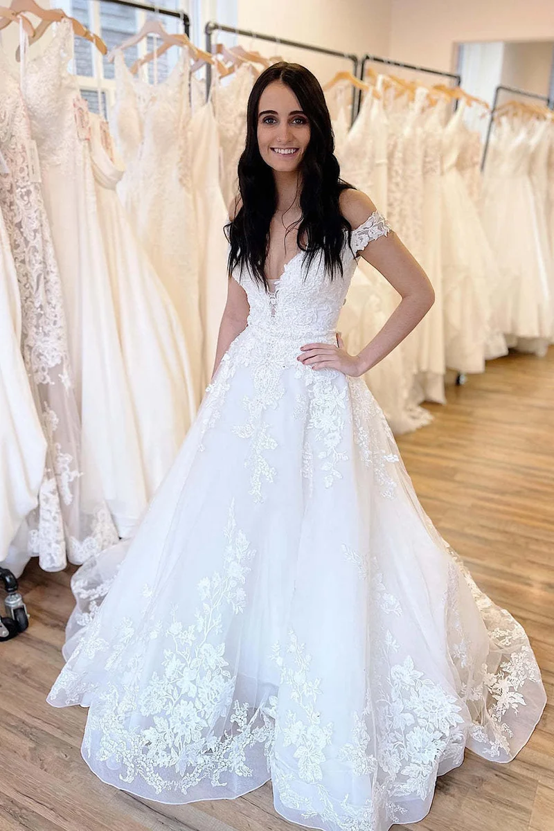 Robe de mariée élégante à épaules dénudées, coupe trapèze, avec des appliques en dentelle délicates et une traîne