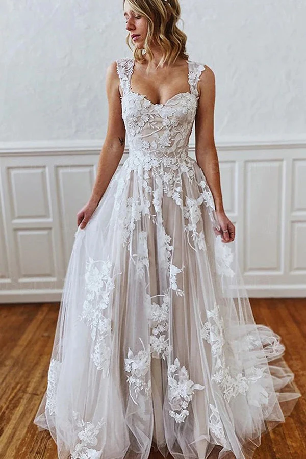 Robe de mariée élégante à bretelles, coupe trapèze, avec des appliqués exquis et une traîne chapelle