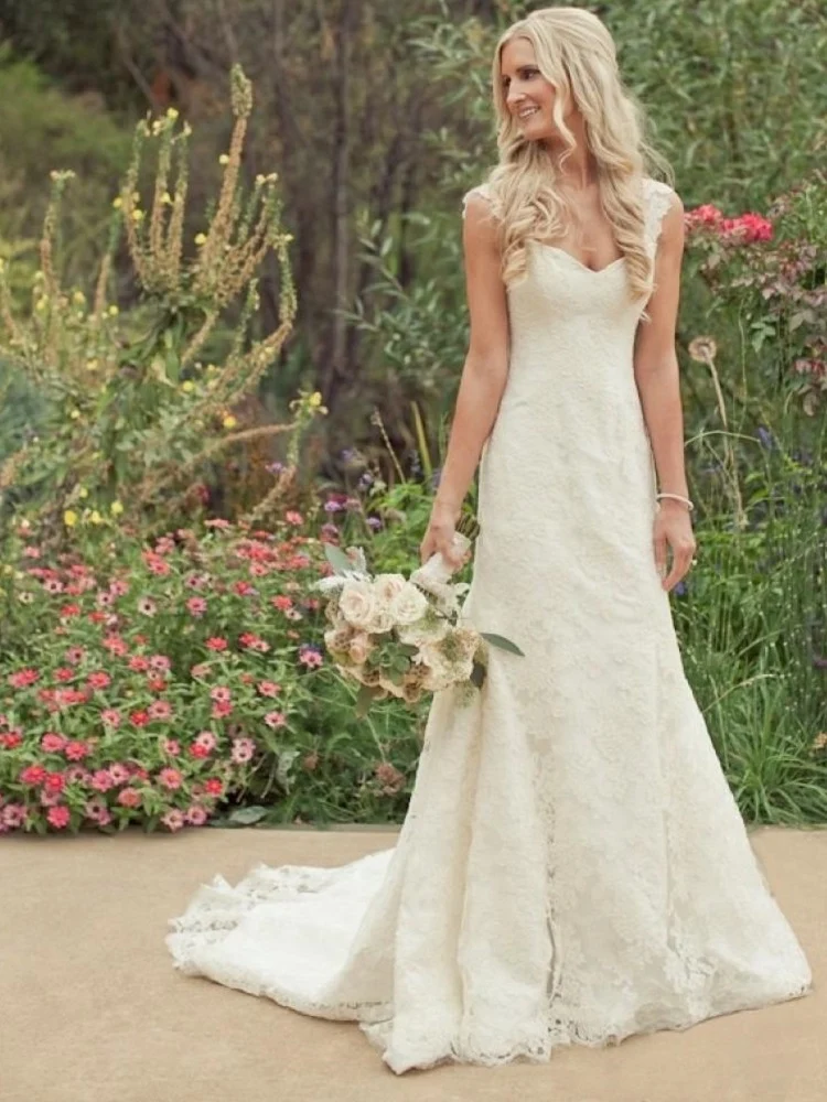 Robe de mariée en dentelle ridiculement époustouflante avec mancherons