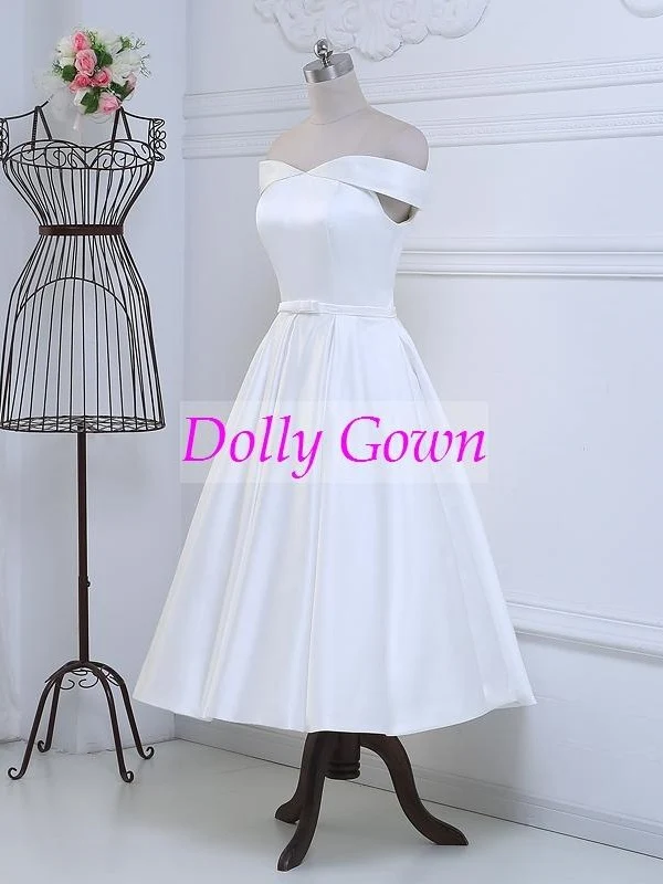 Jolie robe de mariée vintage, épaules dénudées, longueur thé, inspirée des années 50, avec joli nœud à la taille