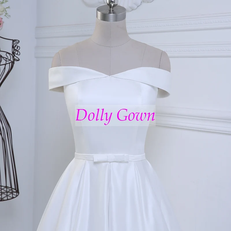 Jolie robe de mariée vintage, épaules dénudées, longueur thé, inspirée des années 50, avec joli nœud à la taille