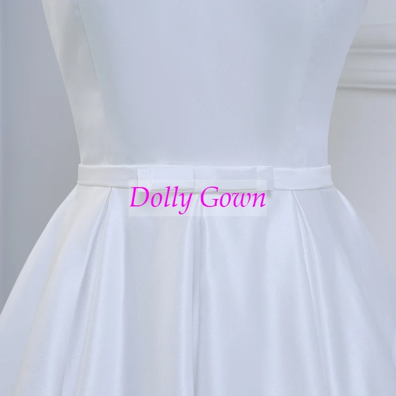 Jolie robe de mariée vintage, épaules dénudées, longueur thé, inspirée des années 50, avec joli nœud à la taille