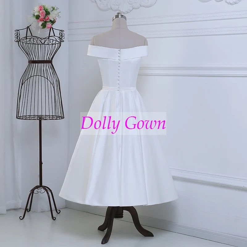 Jolie robe de mariée vintage, épaules dénudées, longueur thé, inspirée des années 50, avec joli nœud à la taille