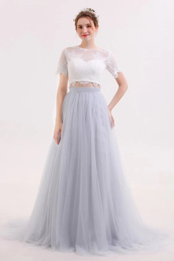 Robe de mariée deux pièces avec jupe longue en tulle et haut court en dentelle