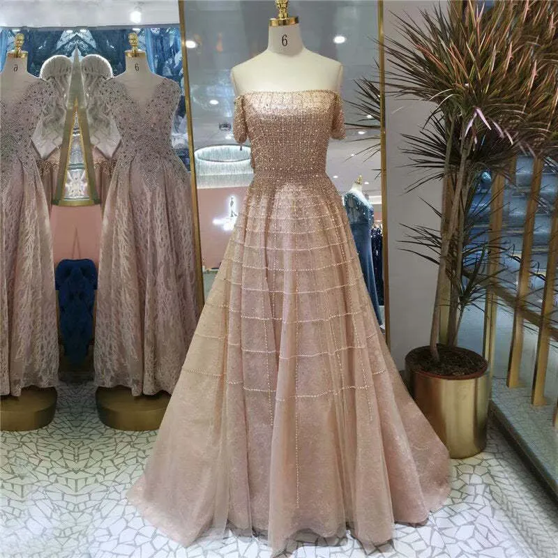 Robe de bal élégante à paillettes, épaules dénudées, manches longues, coupe trapèze