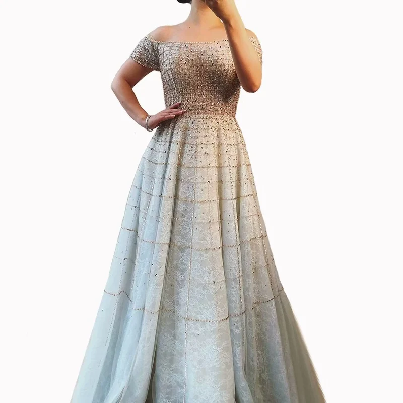 Robe de bal élégante à paillettes, épaules dénudées, manches longues, coupe trapèze