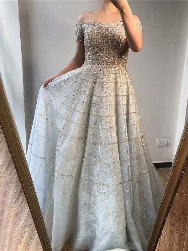 Robe de bal élégante à paillettes, épaules dénudées, manches longues, coupe trapèze