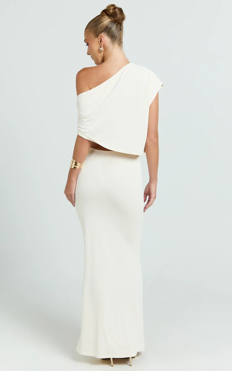 Mila Two Piece Top And Skirt Set - Asymmetric Cape Top And Ruched Floral Trim Maxi Skirt in Ivory