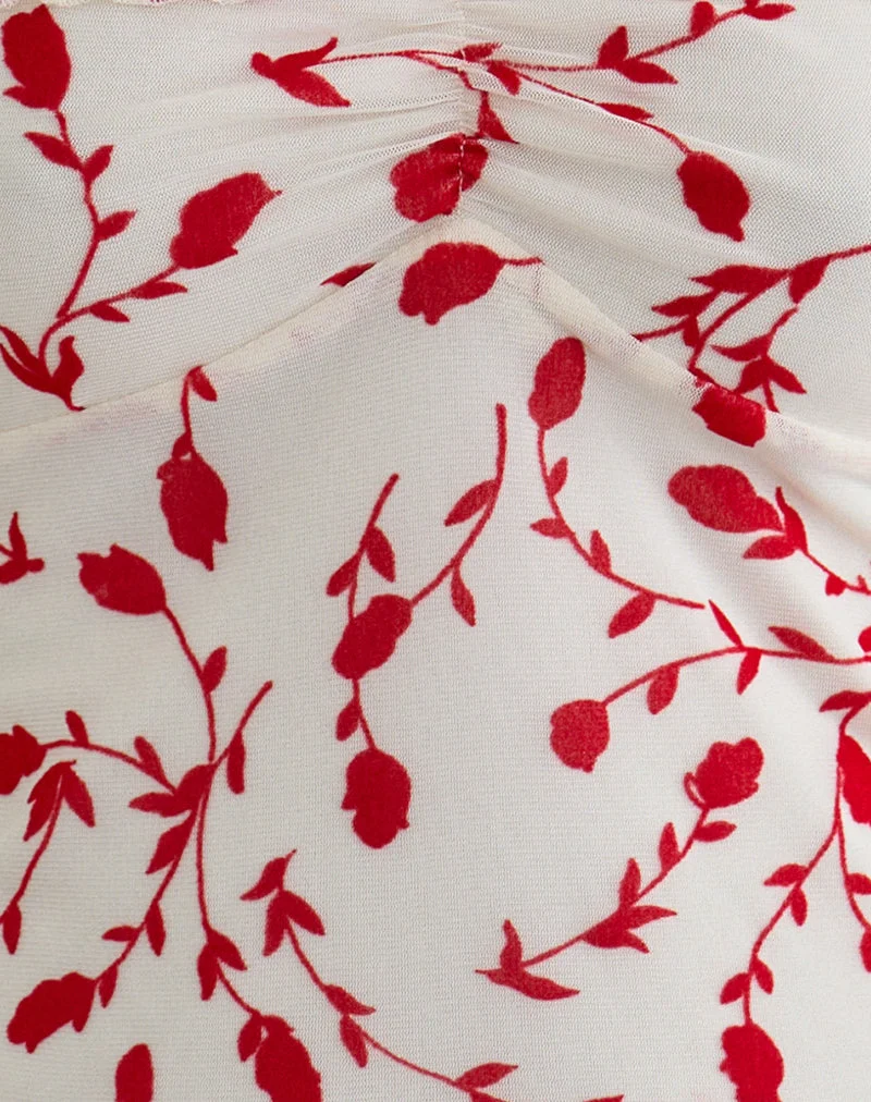 Haut Switi Bardot couleur crème avec motif floqué de lys rouges feuillus