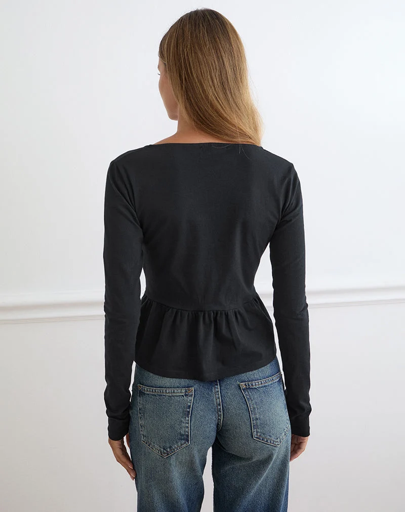 Haut Yahop noir avec broderie florale en spirale