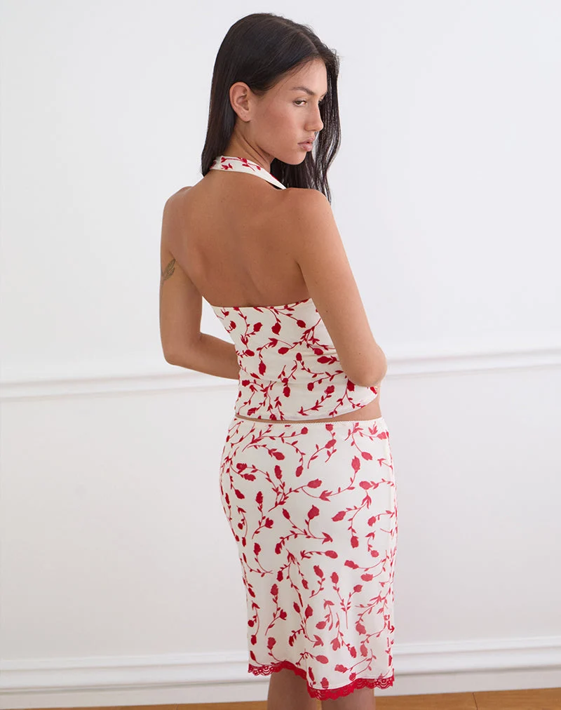 Haut Corsita couleur crème avec motif de lys feuillu rouge en flocage