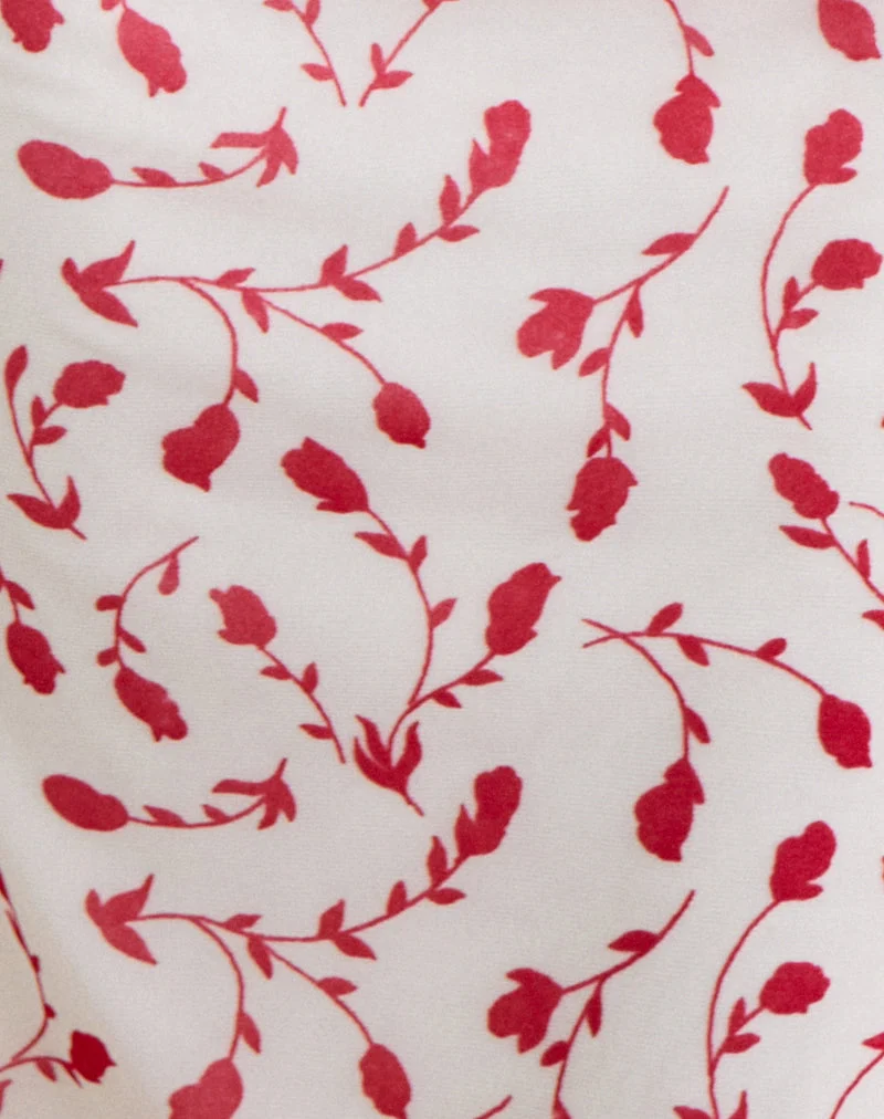 Haut Corsita couleur crème avec motif de lys feuillu rouge en flocage