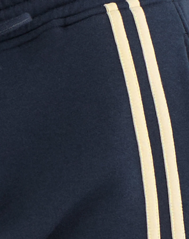 Jogging Covero bleu marine avec bordure couleur beurre