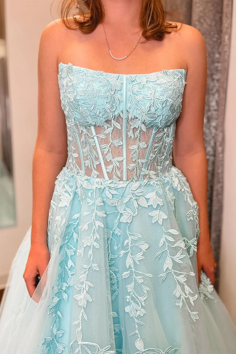 Robe de bal longue transparente sans bretelles avec appliques bleu aqua