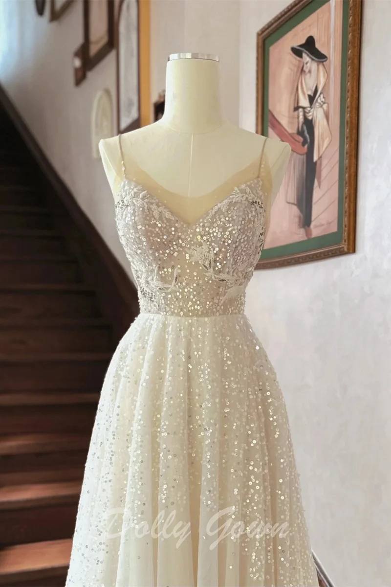 Robe de mariée trapèze transparente à paillettes et bretelles spaghetti