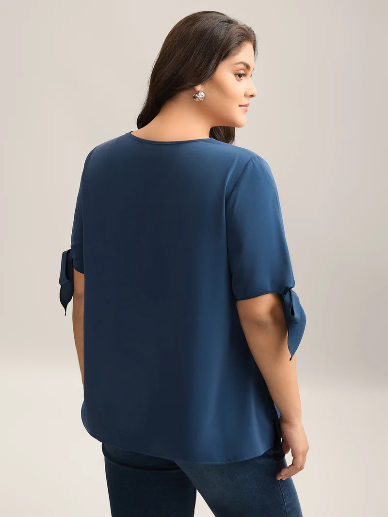 Laser Cut Neckline Knotted Sleeve Blouse