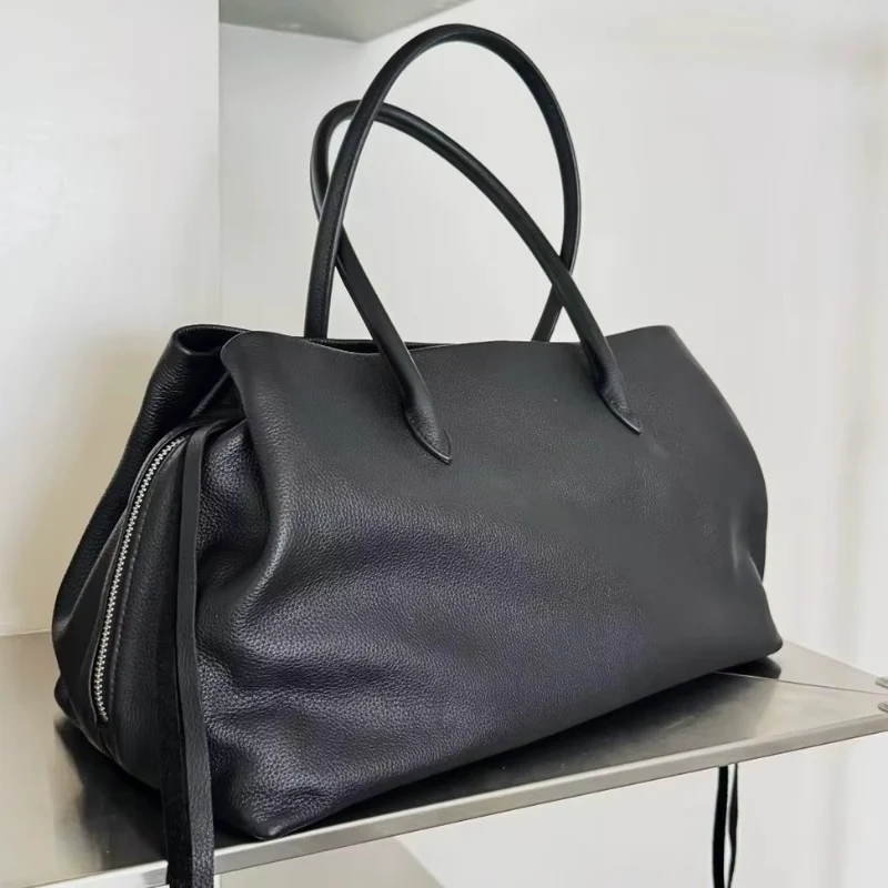 Sac bandoulière femme avec poignée et multiples compartiments zippés
