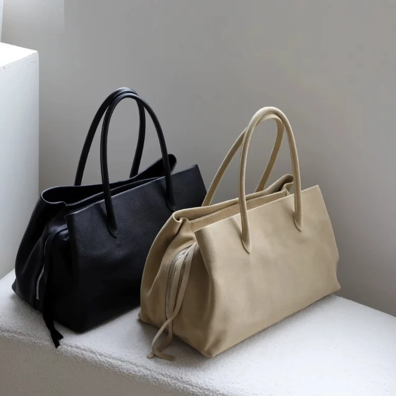 Sac bandoulière femme avec poignée et multiples compartiments zippés