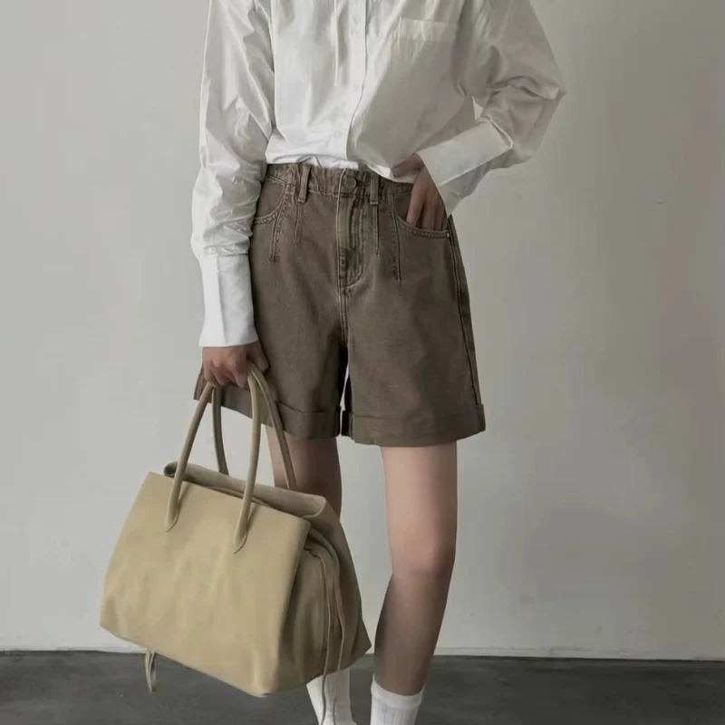 Sac bandoulière femme avec poignée et multiples compartiments zippés