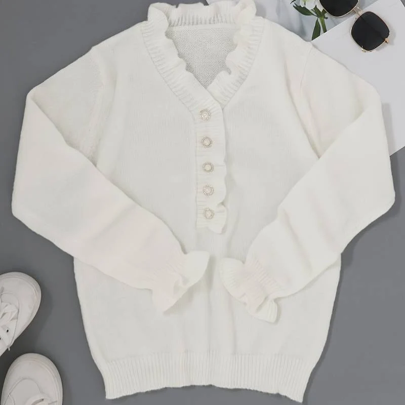 Blouse à volants avec boutons décoratifs et manches longues