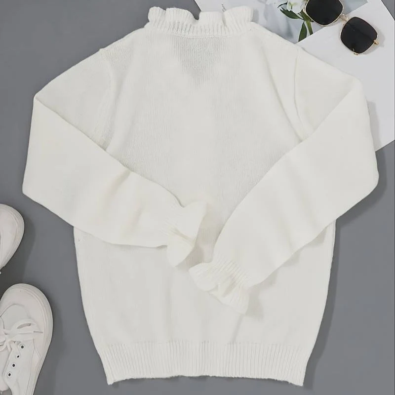 Blouse à volants avec boutons décoratifs et manches longues
