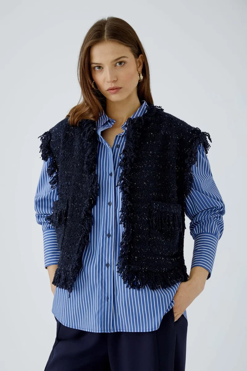 Veste sans manches bouclée à franges