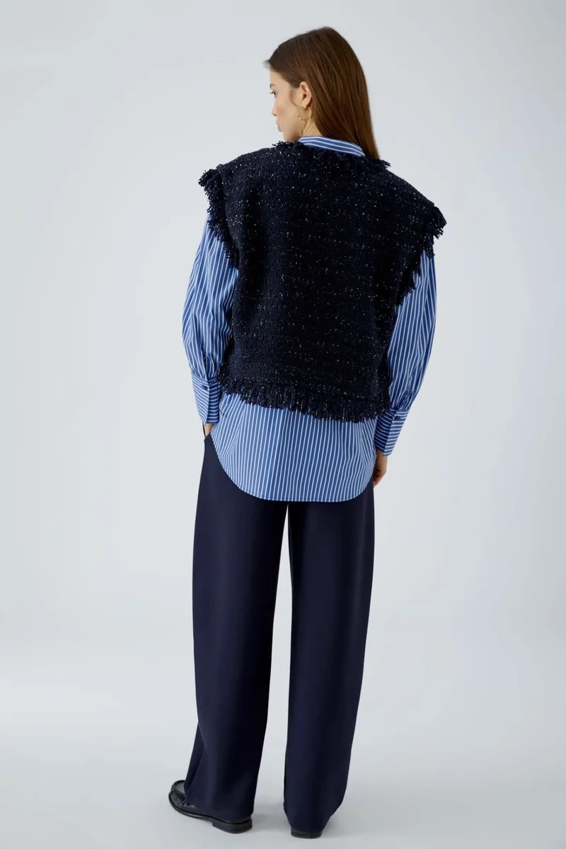 Veste sans manches bouclée à franges