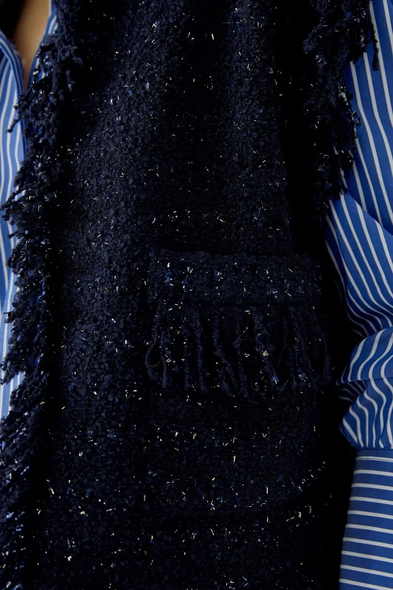Veste sans manches bouclée à franges