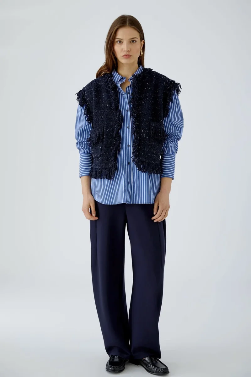 Veste sans manches bouclée à franges