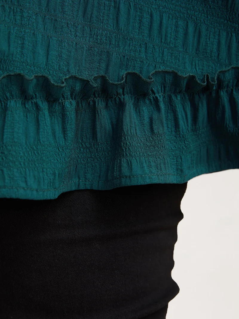 Textured Spliced Ruffle Edge Top