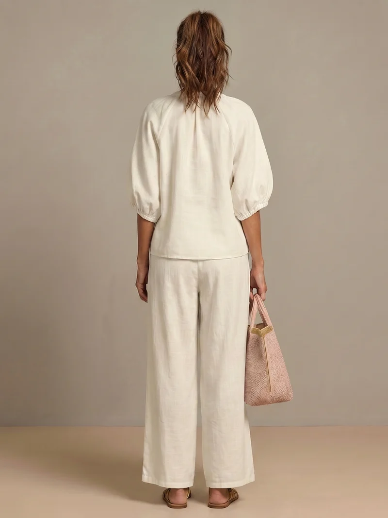 Ensemble blouse zippée et pantalon à jambes larges pour femme